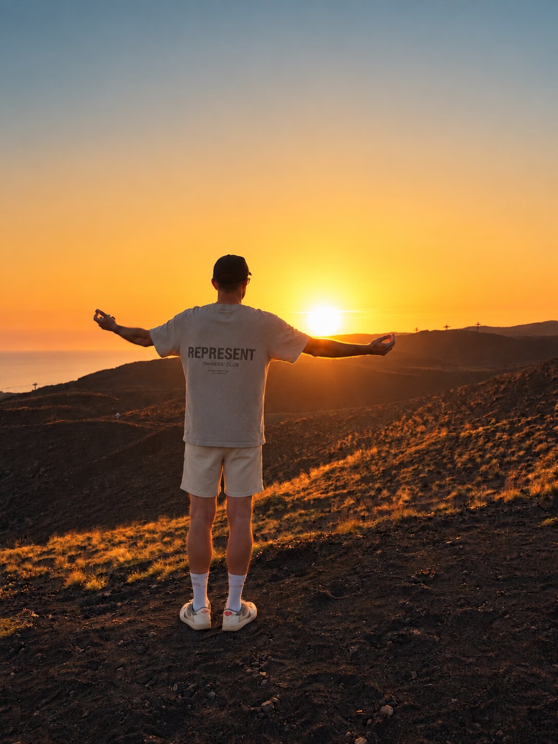 John Stainer standing on Mount Etna at sunset